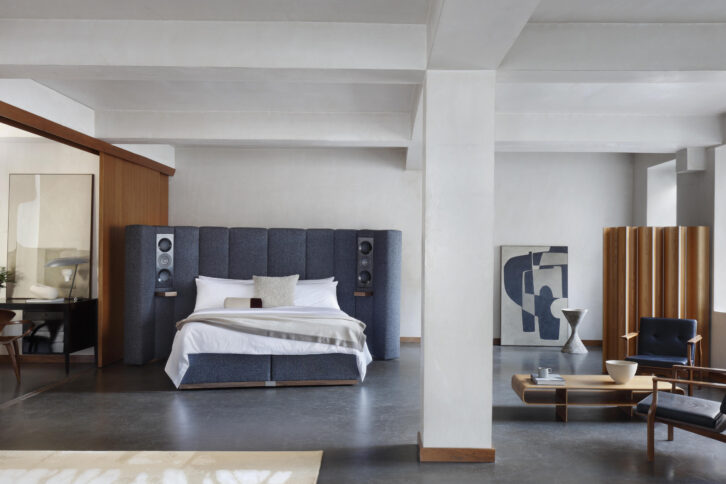 Savoir Sevenrty-Five bed with built-in KEF speakers in a bedroom.