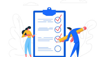 Two people working on a checklist