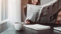 Woman reading a newspaper