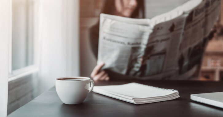 Woman reading a newspaper