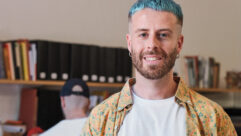 A blue-haired employee