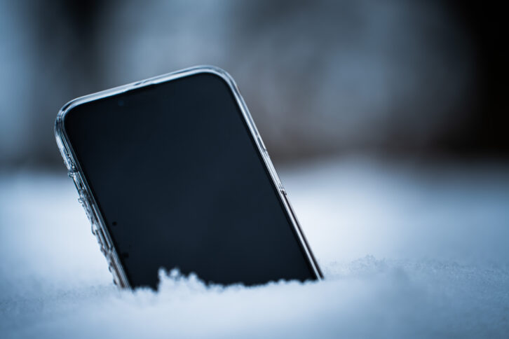 Phone in the snow to represent cold calling.