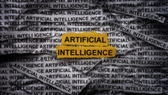 Strips of newspaper with the words Artificial Intelligence typed on them. Close up.